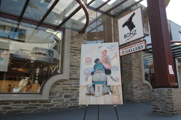 Graham Henry &#8211; Tattoo by Thomas Brown, pictured in front of the BONZ Gallery Queenstown Mall